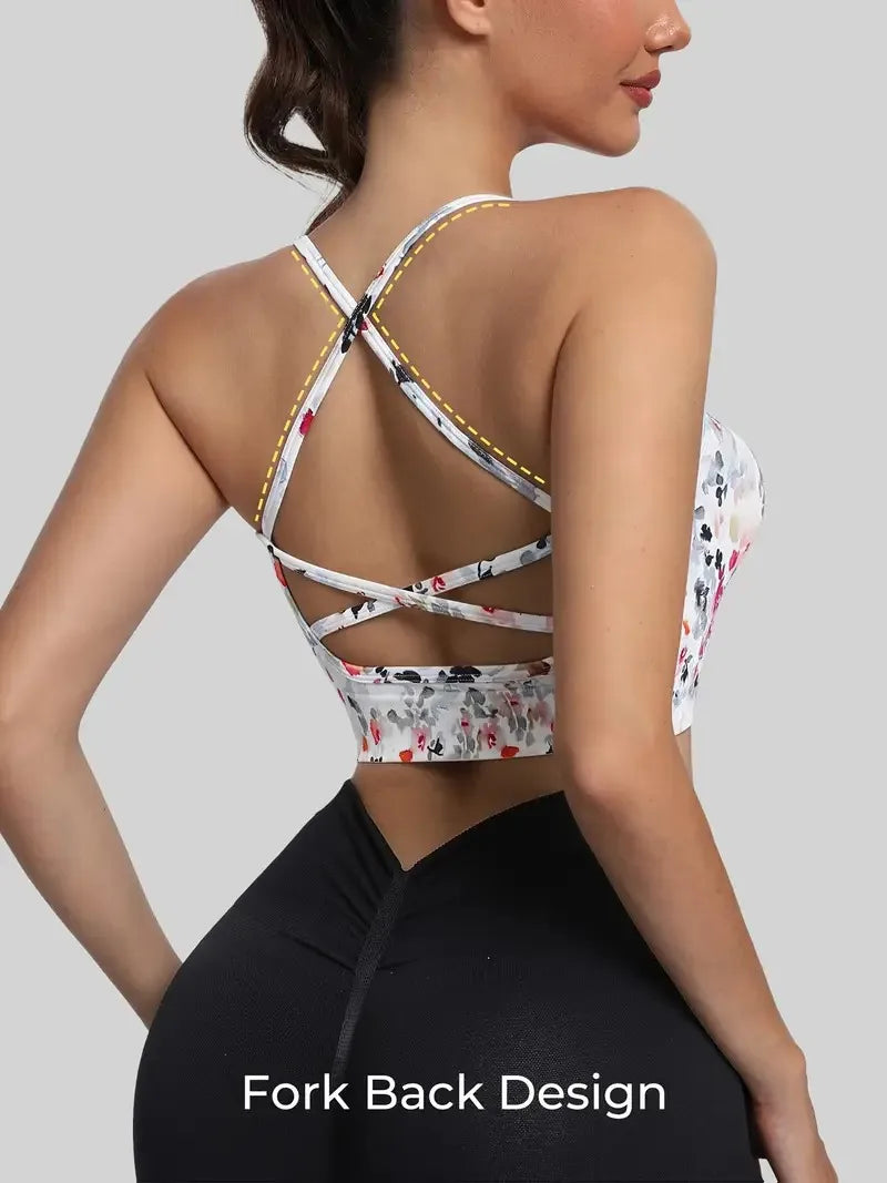 Top esportivo feminino com alças cruzadas nas costas e estampa floral